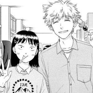 a picture of shima sousuke and iwakura mitsumi from the skip to loafer manga. they are posing for a picture, with shima smiling while showing off a fruit kebab, and iwakura smiling as well with a spoon in her mouth- holding up a peace sign.